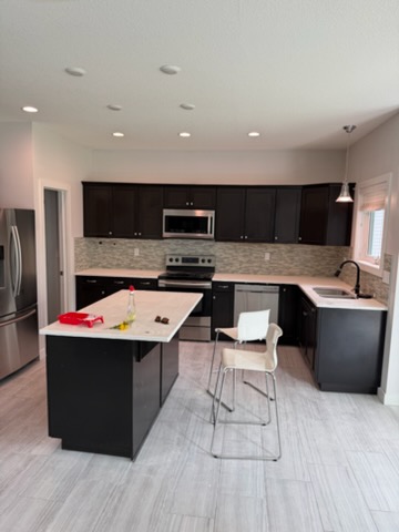 Freshly painted open-concept kitchen and living area